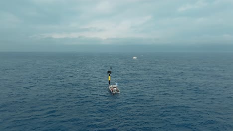 aerial orbiting shot of a scientific boat conducting research off the coast of sete