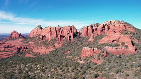 red rock sandstone formations above valley and sedona az usa, drone aerial view