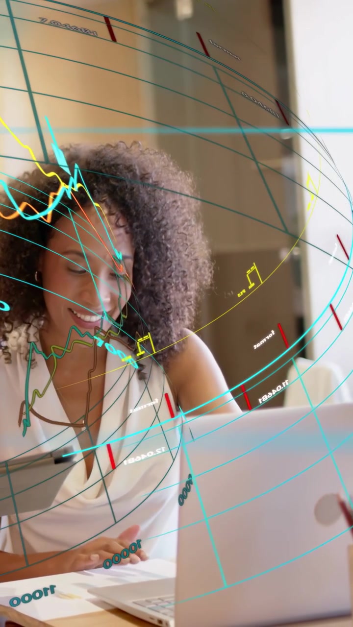 Vertical video: Woman typing on laptop, using data and causing holo globe charts and lines to move