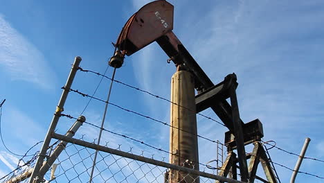 an oil derrick pumps oil