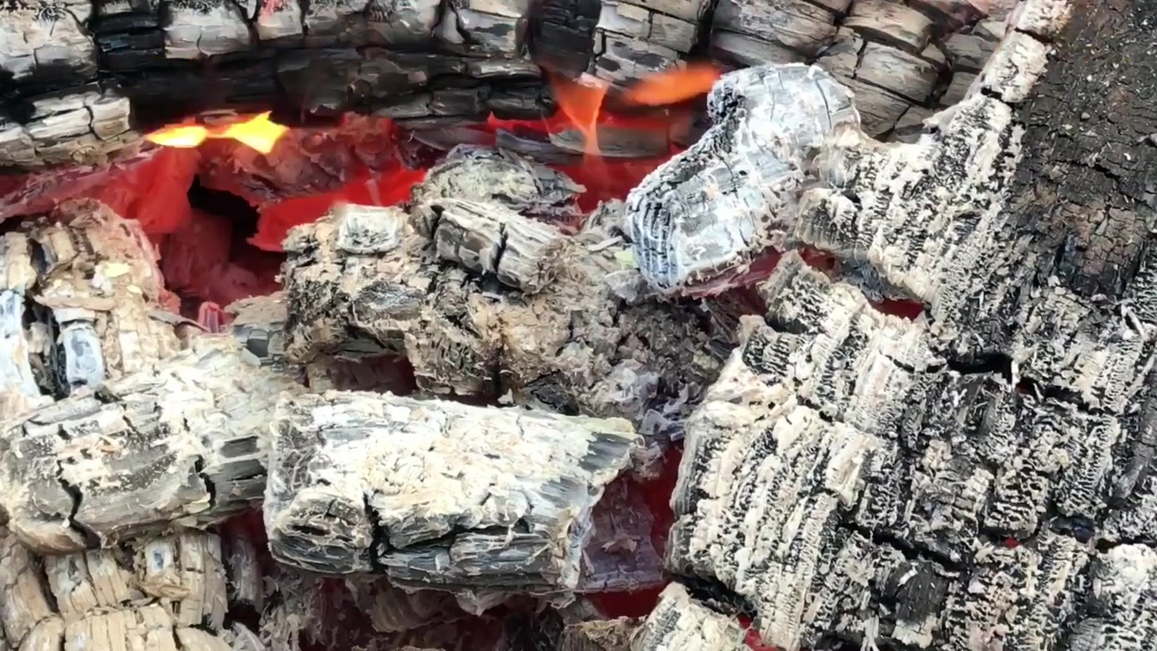 Glowing Hot Charcoal close up. Embers of fire. Burning firewood