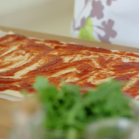 Woman-making-a-traditional-Italian-pizza