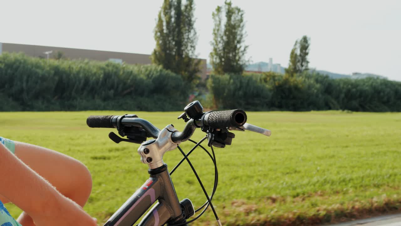 Man ride bicycle near beach in Barcelona, city morning, carbon neutral transportation. Travel, sustainability and cycling with male speed and transit,