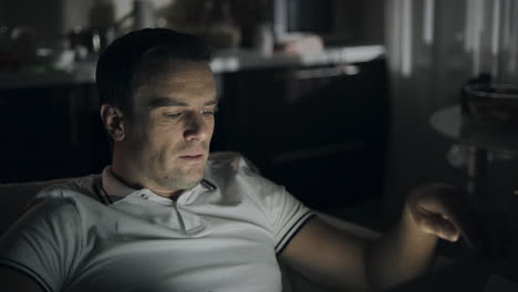 Closeup-hardworking-man-yawning-in-front-of-laptop-at-night-office.