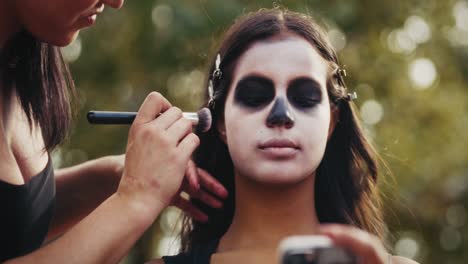 applying sugar skull makeup