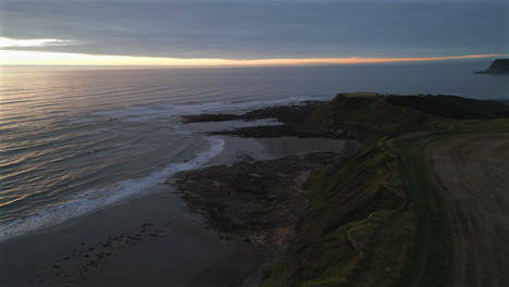 Establishing-Aerial-Drone-Shot-of-Cleveland-Way-at-Sunrise-in-Scarborough