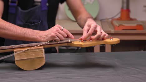 putting new string on an electric guitar