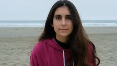 close up portrait of casual brunette young woman smiling