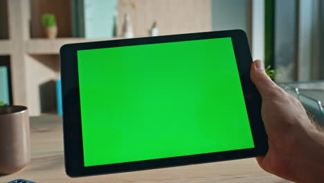 user touching chroma key tablet working at agency office close up. unknown man