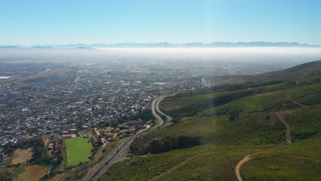 panorama of ou kaapse weg road and townscape of lakeside in cape town, south africa