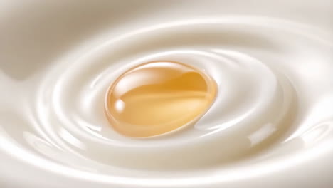golden droplet on creamy white surface