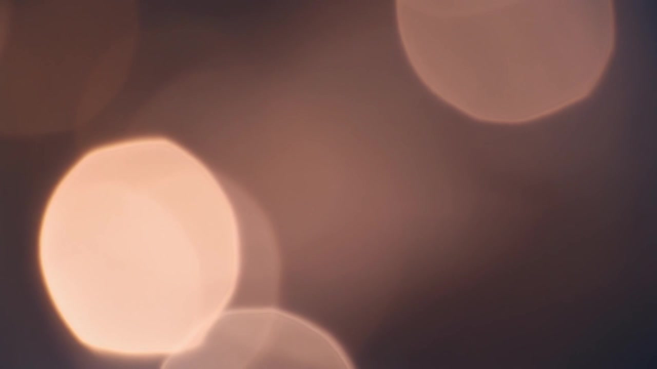 Abstract Background of Soft Glowing Golden Bokeh Lights
