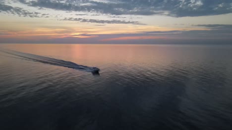 Boat on the Ocean at Sunset