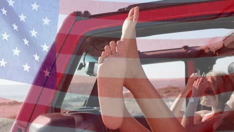 Animation-of-flag-of-usa-over-happy-diverse-women-in-car-by-beach-in-summer