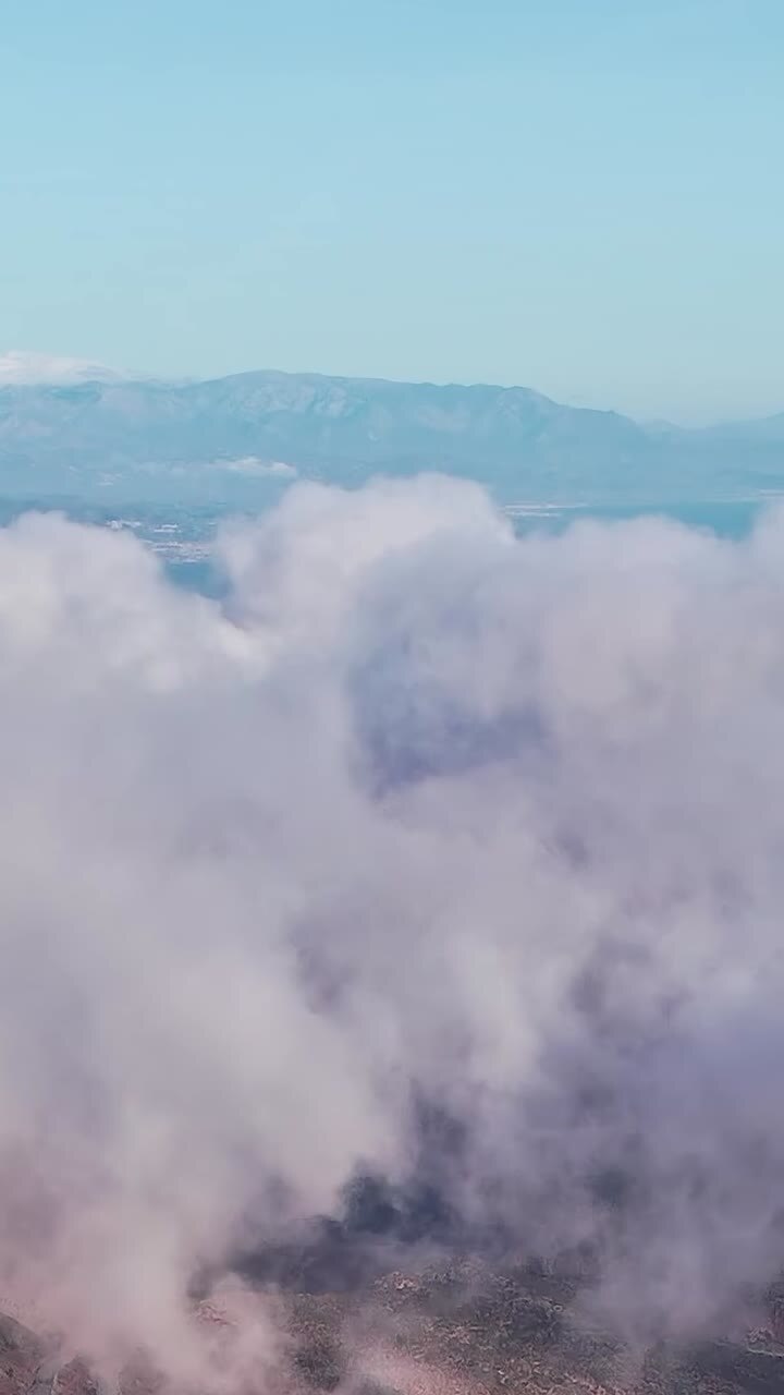 Clouds cover hills in Malaga, Spain during a morning scene