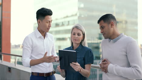 business people, tablet and rooftop conversation