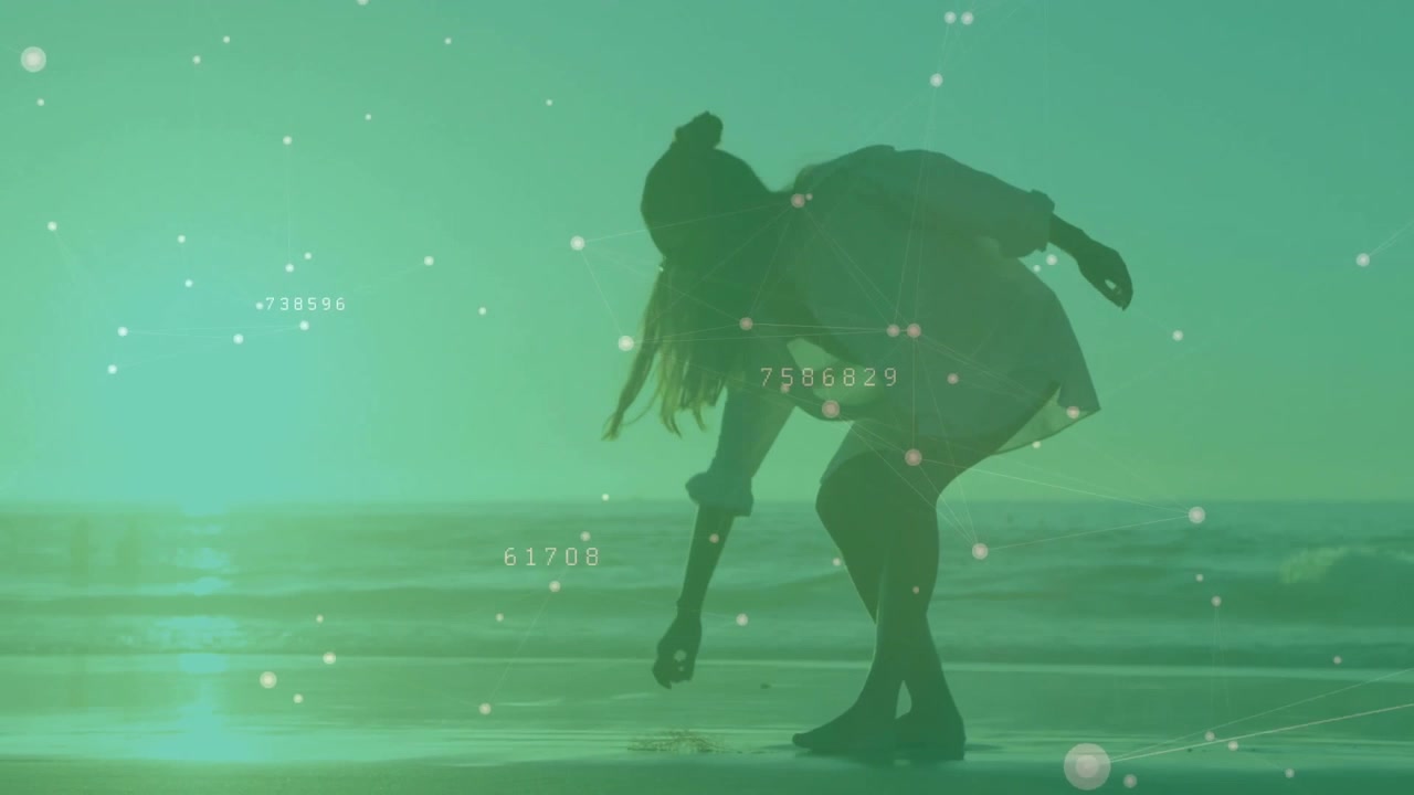 Woman entering shore from right and picking shell for inspecting on sand while tech data drifting