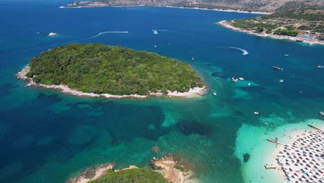 Ksamil-Coastline:-Emerald-Islands,-Turquoise-Seas,-and-Pristine-White-Sands-Beach-Along-Albania's-Stunning-Mediterranean-Shore