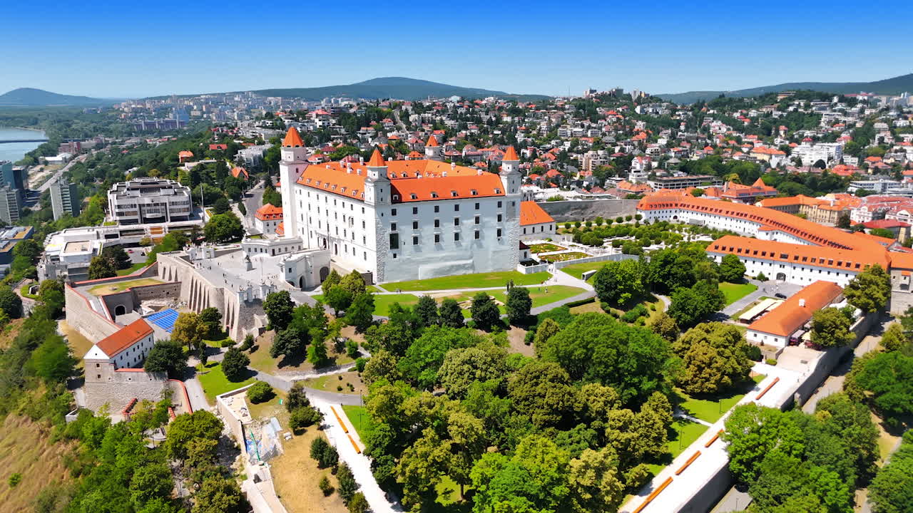Bratislava Castle with gardens and panoramic view. The historic Bratislava Castle is surrounded by gardens with a wide panoramic view of the city