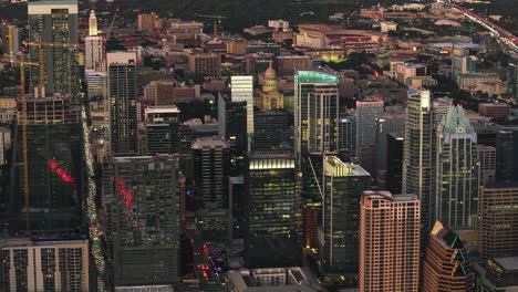 aerial view over skyscrapers, toward the texas state capitol, sunset in austin