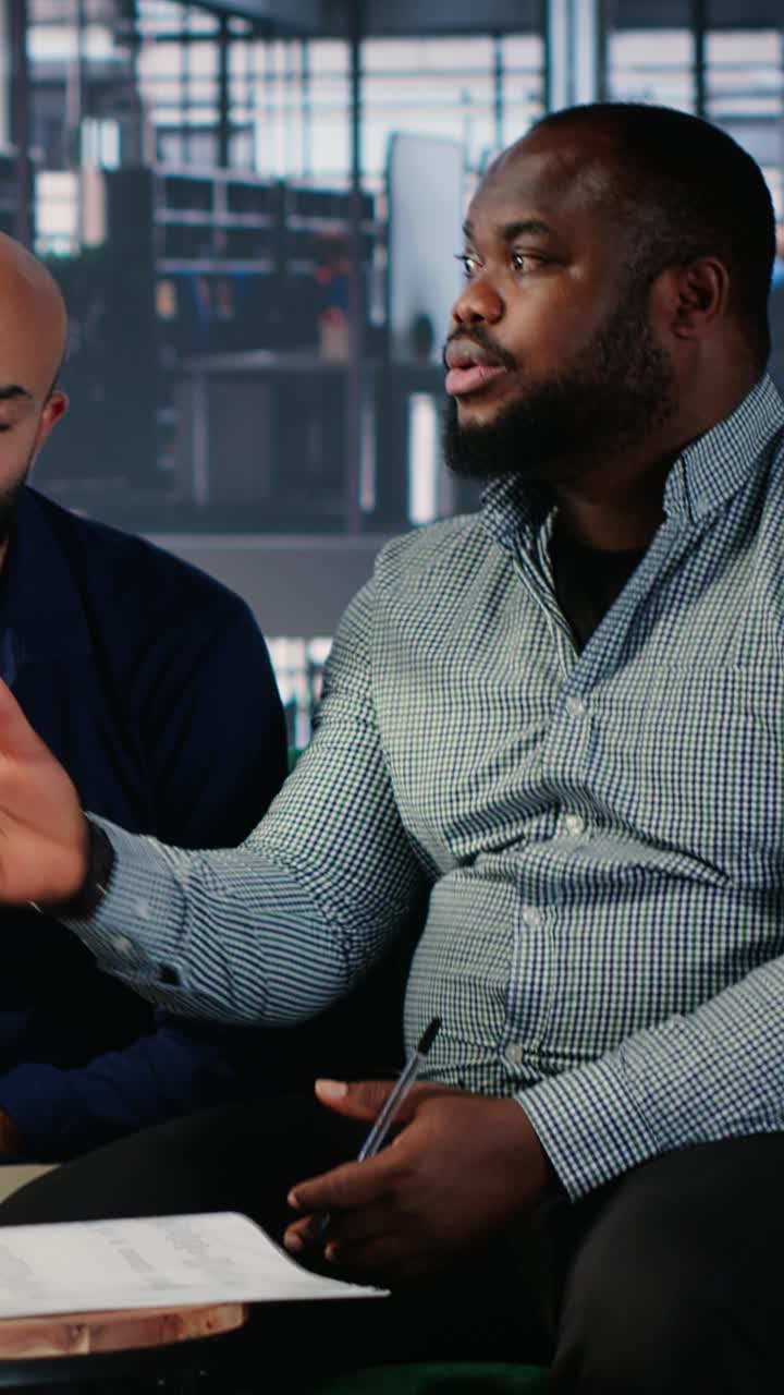 Vertical Video Business meeting in a corporate office involving executive decision making