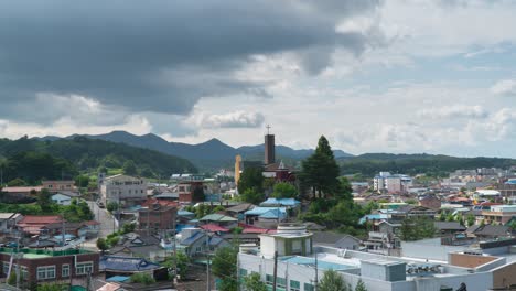 Gray-Clouds-Over-Church-And-Residential-Buildings-In-Geumsan-County,-South-Chungcheong-Province,-South-Korea