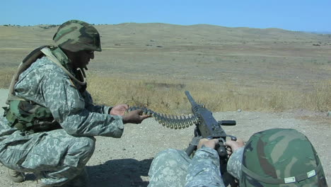 a soldier fires an automatic weapon 1