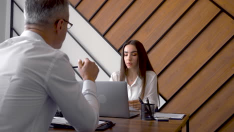 a manager is firing a worker in an office