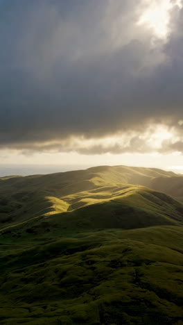 sunrise or sunset over green hills