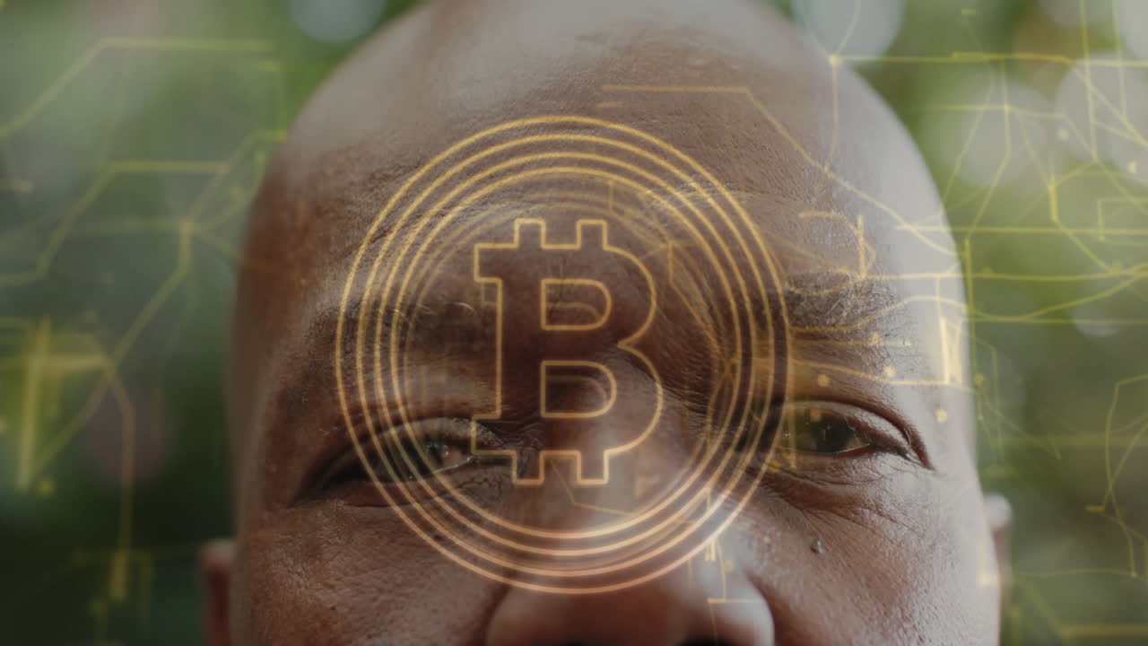 Bitcoin symbol and digital network animation over close-up of person's face