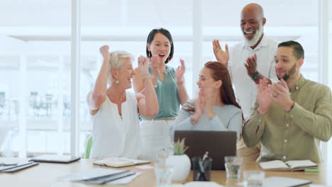 Business-people-on-laptop-with-high-five