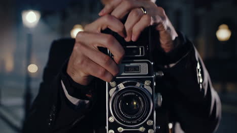 vintage photographer in a foggy night city street