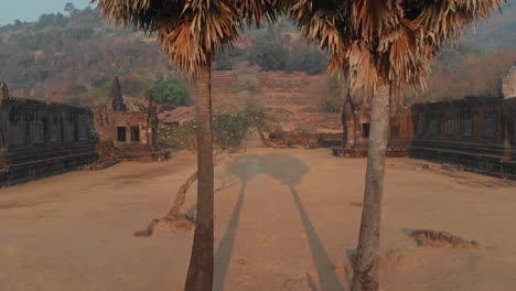 The-famous-Vat-Phou-Temple-Ruin-In-Laos-during-sunrise,-aerial