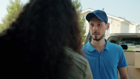 delivery person delivering package at home