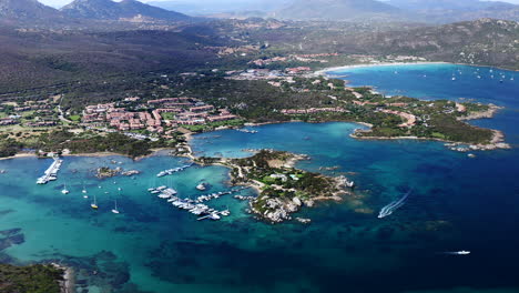 aerial drone view of aranci gulf yacht port, emerald coast, sardinia, italy