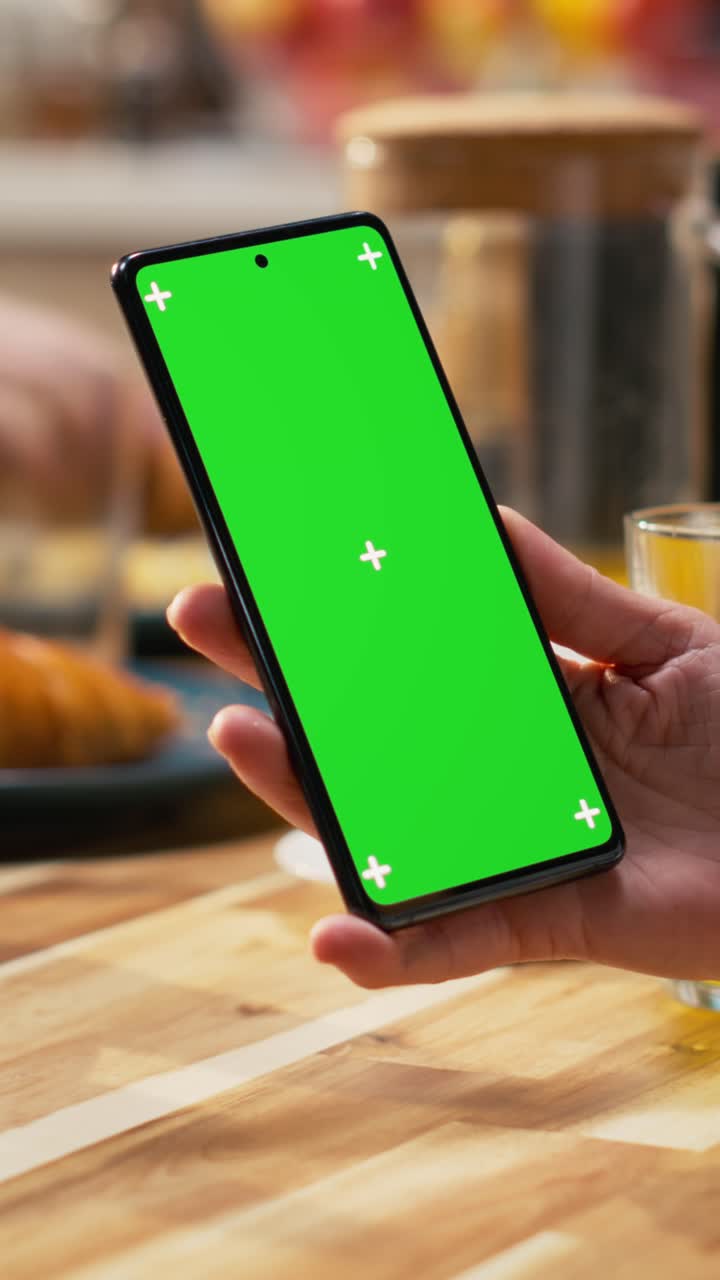 Vertical Video Vertical green screen smartphone held by mom serving breakfast with daughter