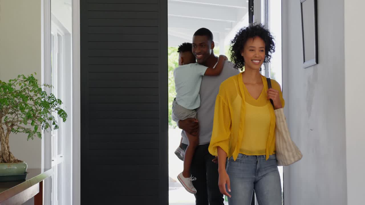 Front view of black family entering in the house 4k