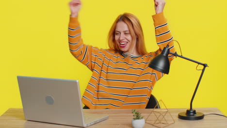 happy woman working on laptop shocked by victory celebrate winning goal achievement good career news