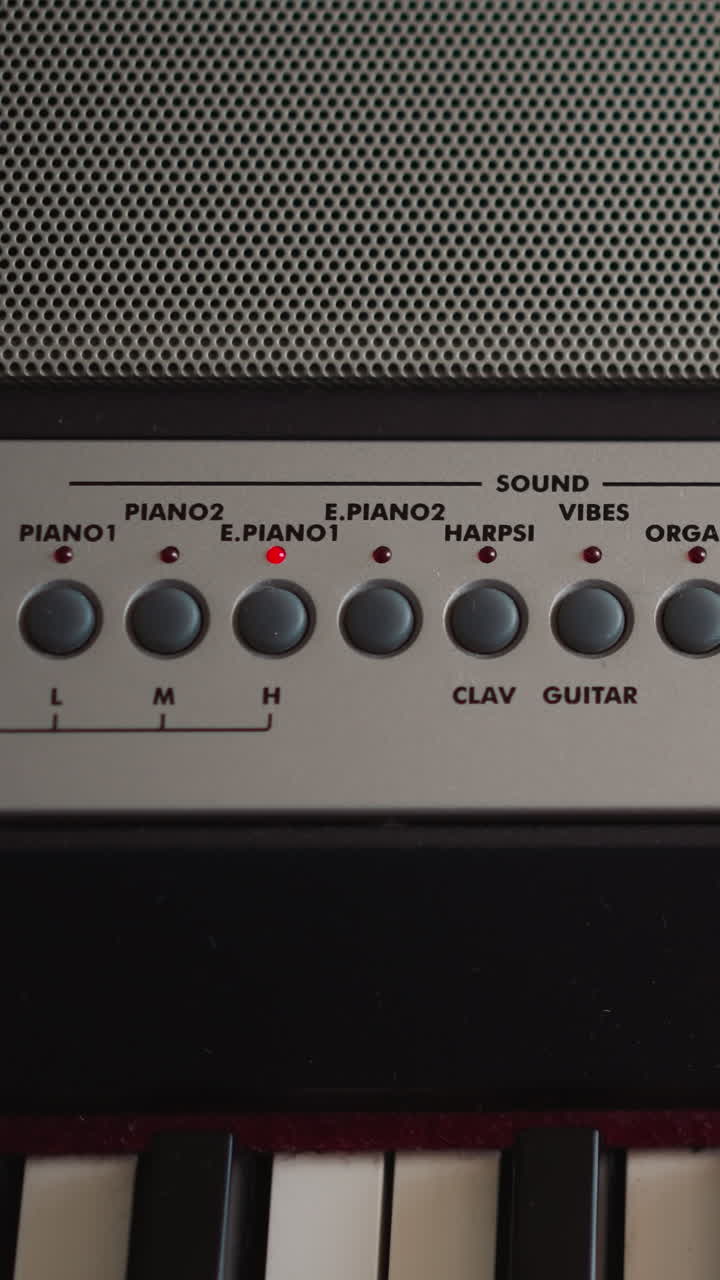 Child hand adjusts tempo turns on metronome and chooses mode on electrical piano control panel closeup. Kid prepares synthesizer to play musical melody