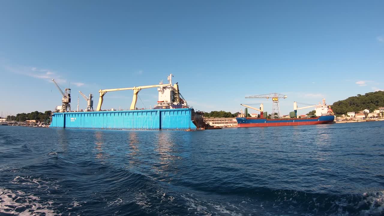 hyper lapse of a dock in harbour with boats on a sunny day, time lapse