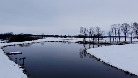 a pond with fresh snow