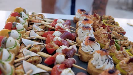 beautifully decorated wedding banquet table with various appetizers and snacks