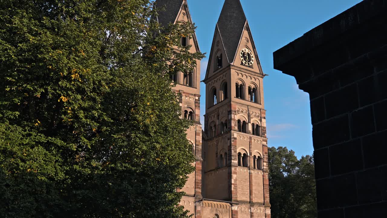 The historic Basilica of St. Castor, the oldest preserved church in Koblenz, Germany, prominently featuring its twin Romanesque western towers