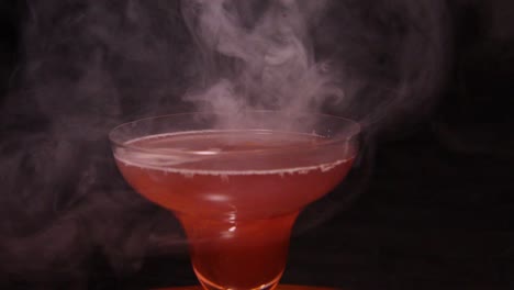 shot of red wine with the smoke into the glass.