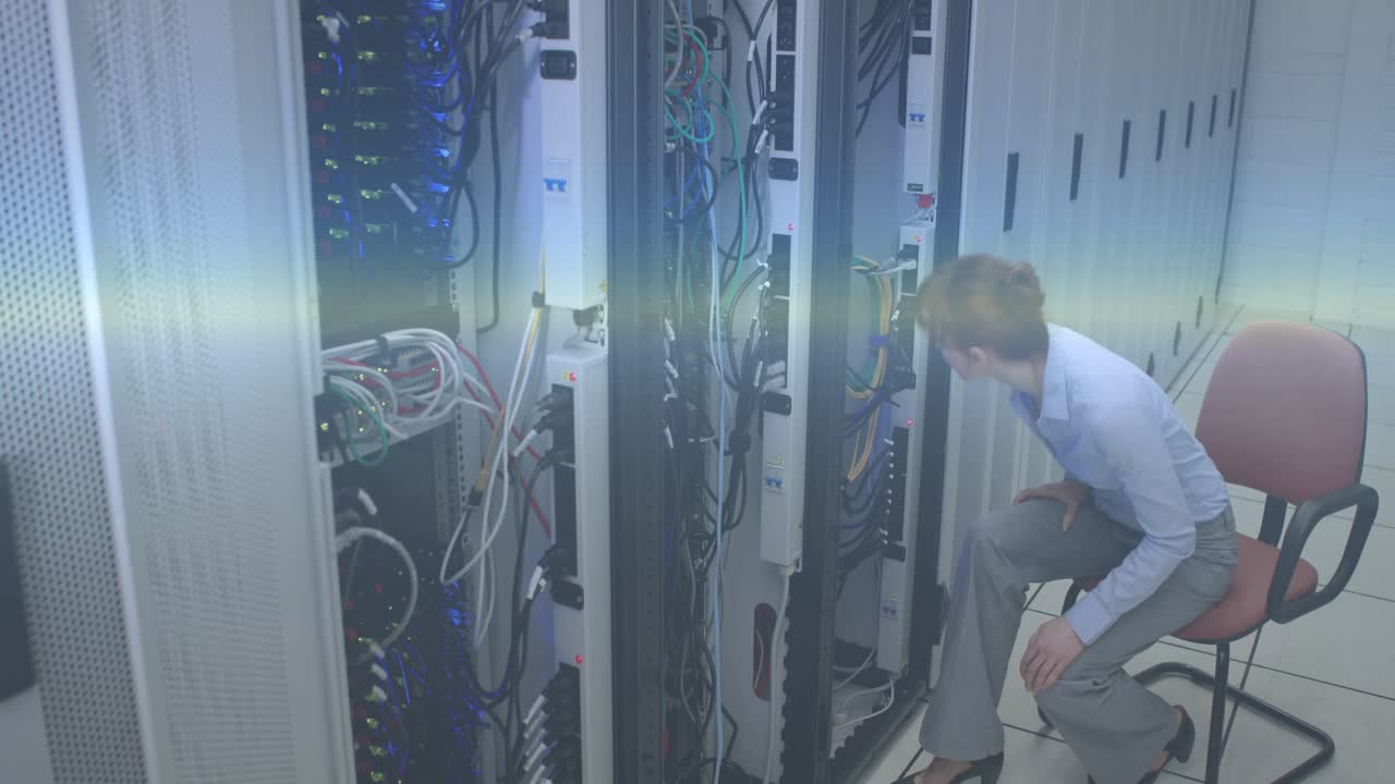 Woman inspecting server racks in IT room, noticing LEDs while overlays highlighting readouts