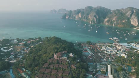 Slow-motion-drone-footage-of-the-beach-and-town-on-Phi-Phi-Islands-Thailand