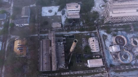 birds eye view of oil refinery plant devastated and abandoned