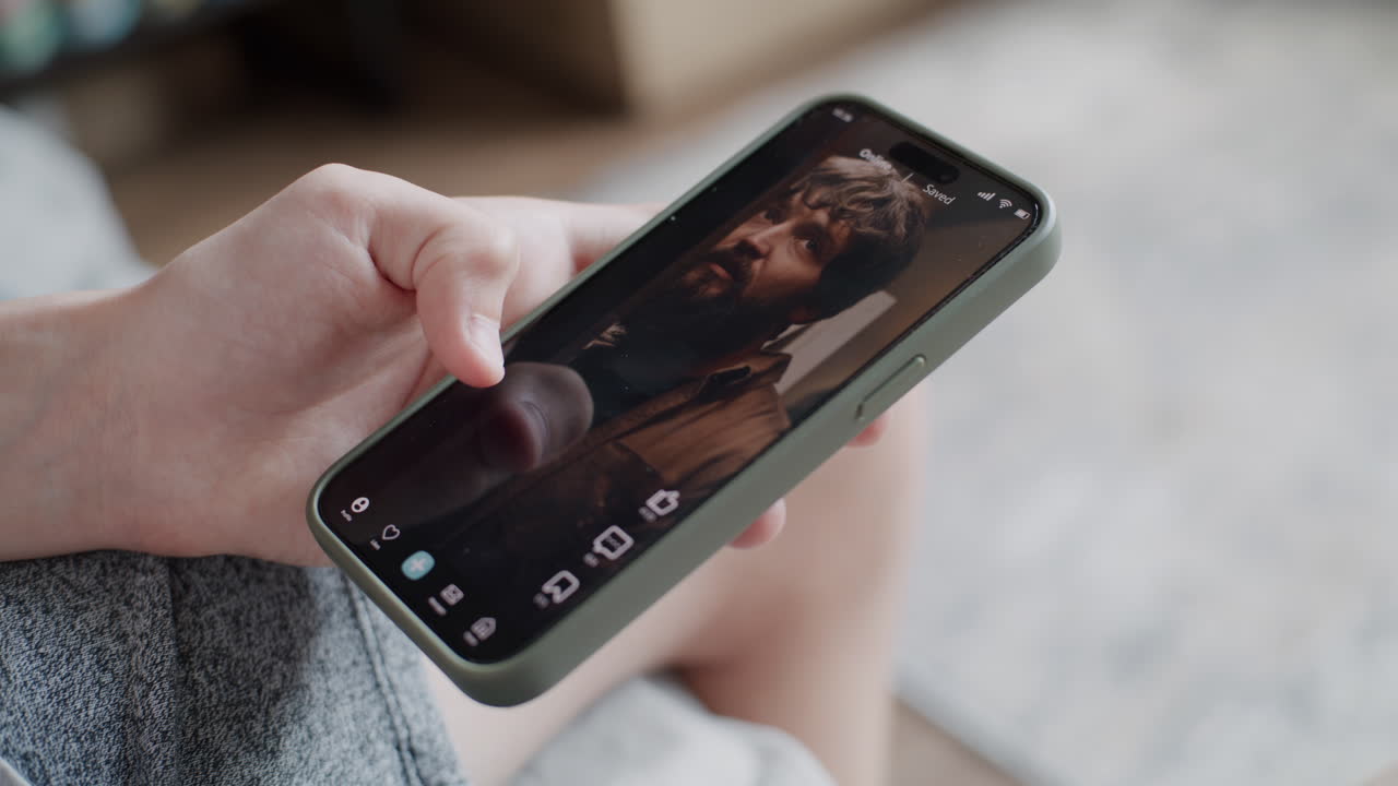 Person watching video on a smartphone