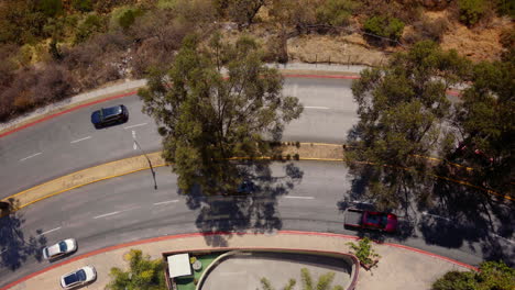 Overhead-View-Of-Cars-Driving-Through-Curved-Road