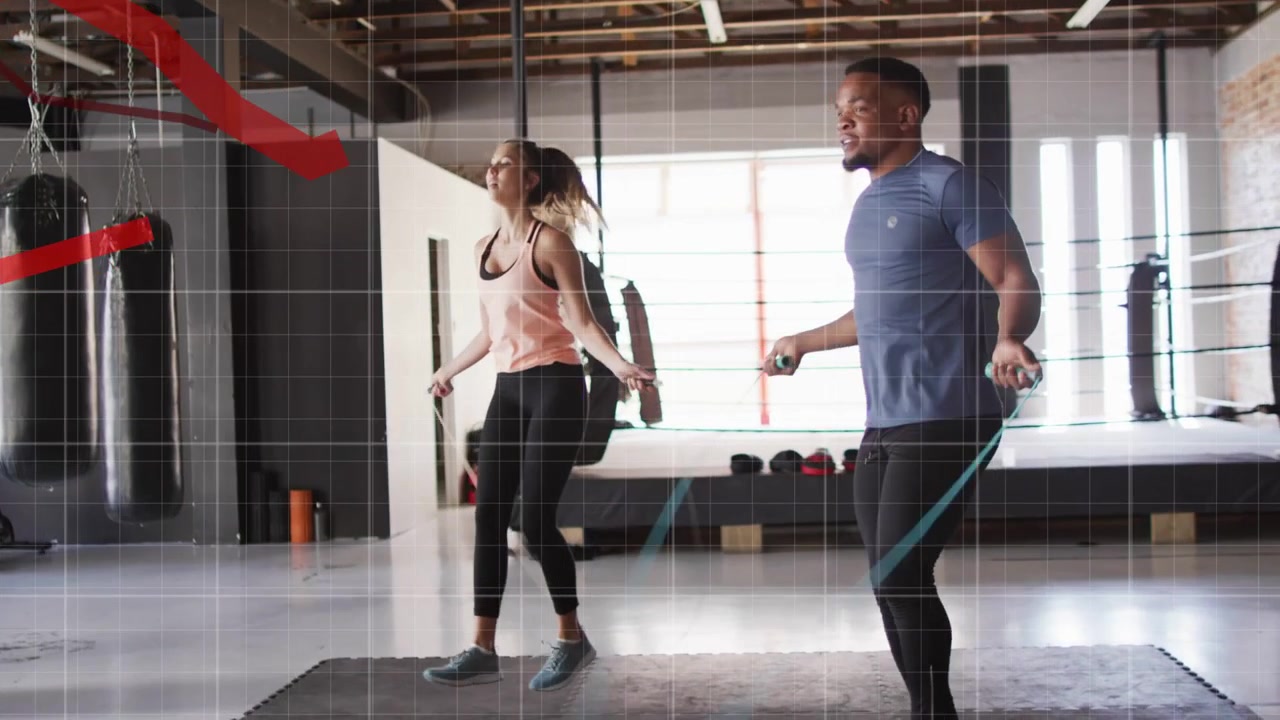 Man and woman initiating swing, doing synced jump-rope training in gym, grid and red line appearing